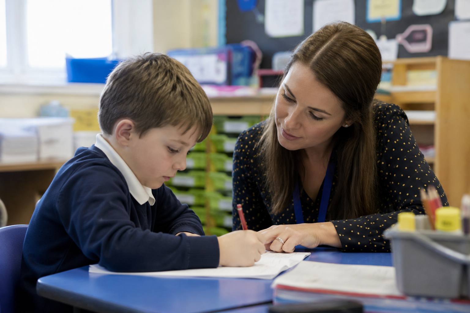 Young boy with teacher in a classroom