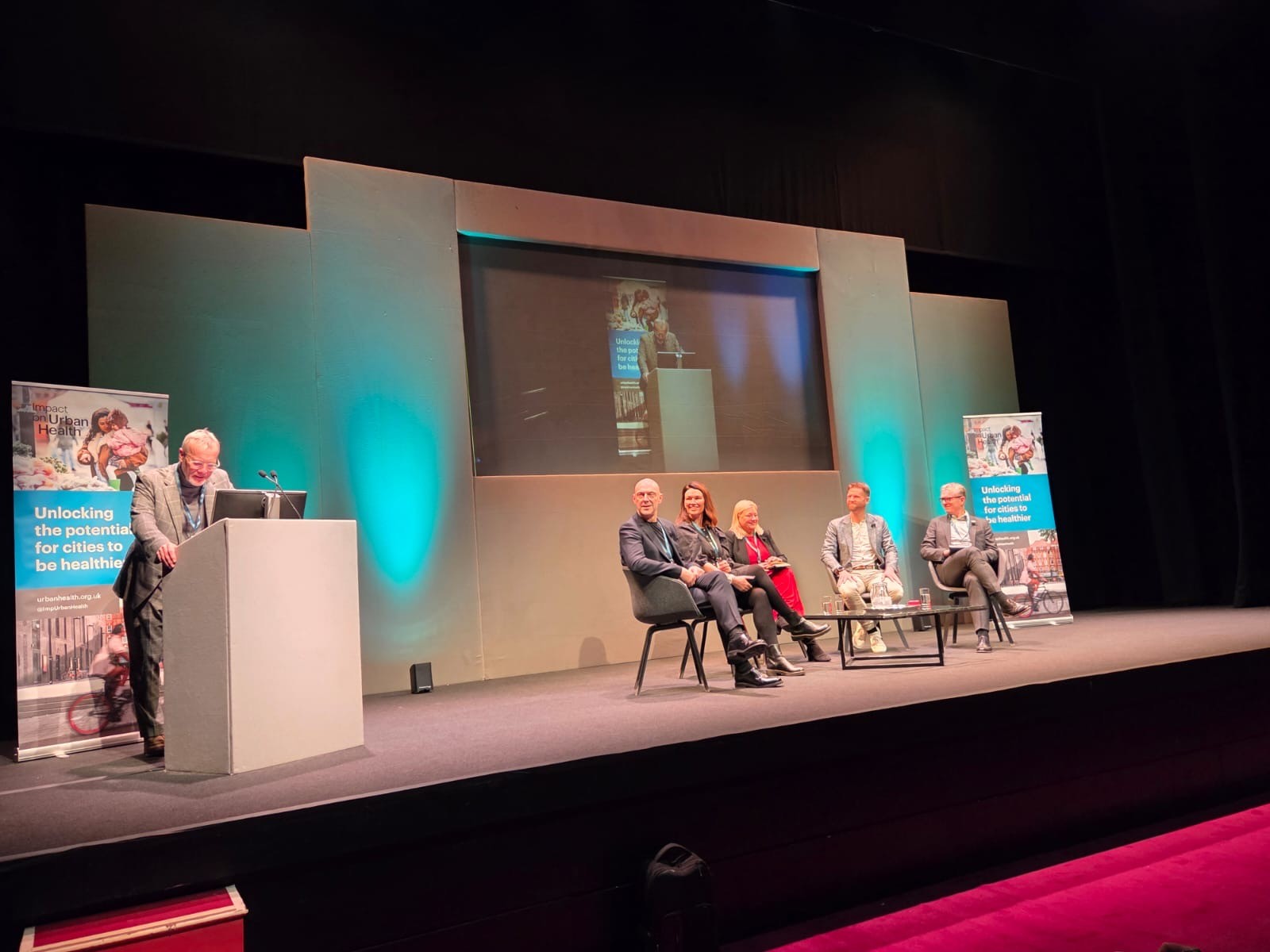 Speakers on stage at the Healthy City Design 2025 International Congress in Salford.
