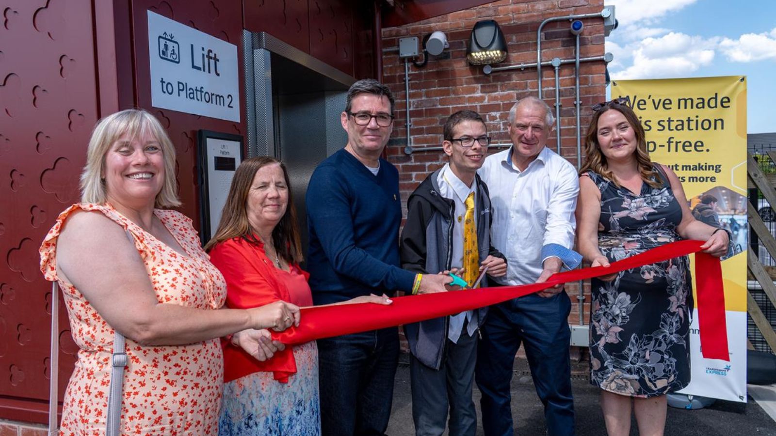 A ribbon-cutting event was held at Irlam station to celebrate the official opening of two new lifts. L-R: Cllr Tracey Rawlins, Disability Advocate on the Bee Network Committee; Cllr Tracy Kelly, Salford's Statutory Deputy City Mayor; Andy Burnham, Mayor of Greater Manchester; Nathaniel Yates, accessibility campaigner; Neil McArthur, Hamilton Davies Trust chair; Cat Morris, Rail Programme sponsor, TfGM.