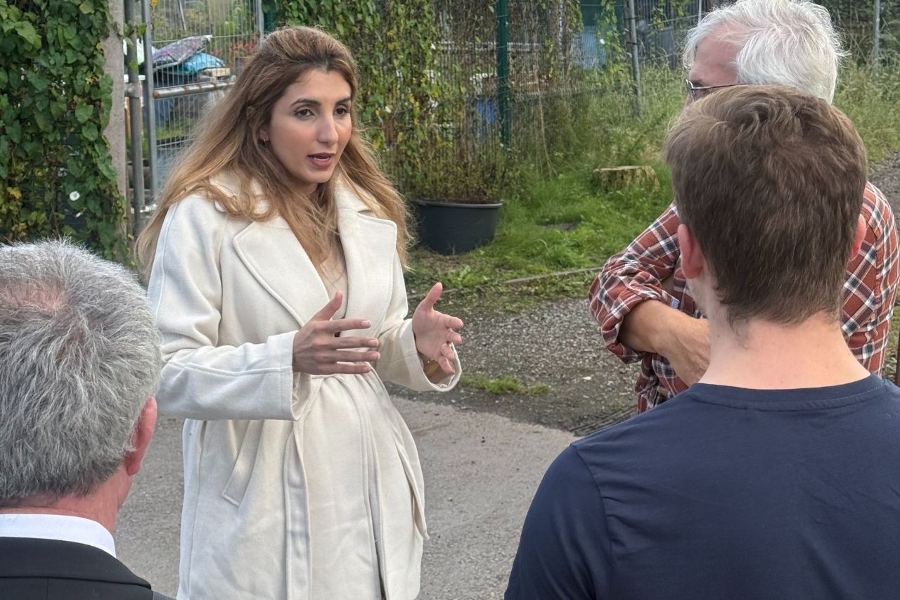 Councillor Mishal Saeed talking to people at Tindall Allotments in Salford
