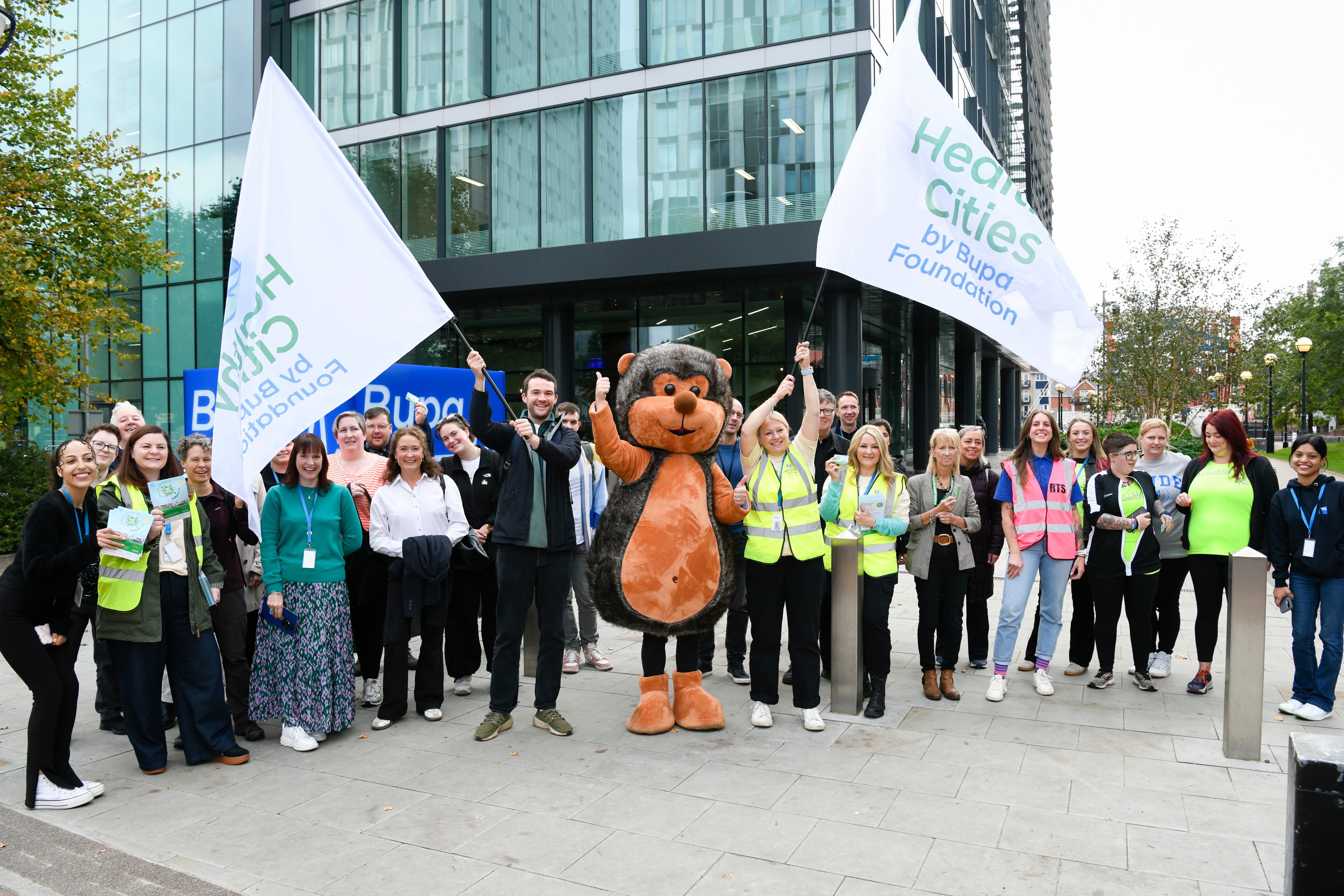 Health and wellbeing partners and local charities outside Bupa Foundation offices in Salford Quays for Beat the Street Salford