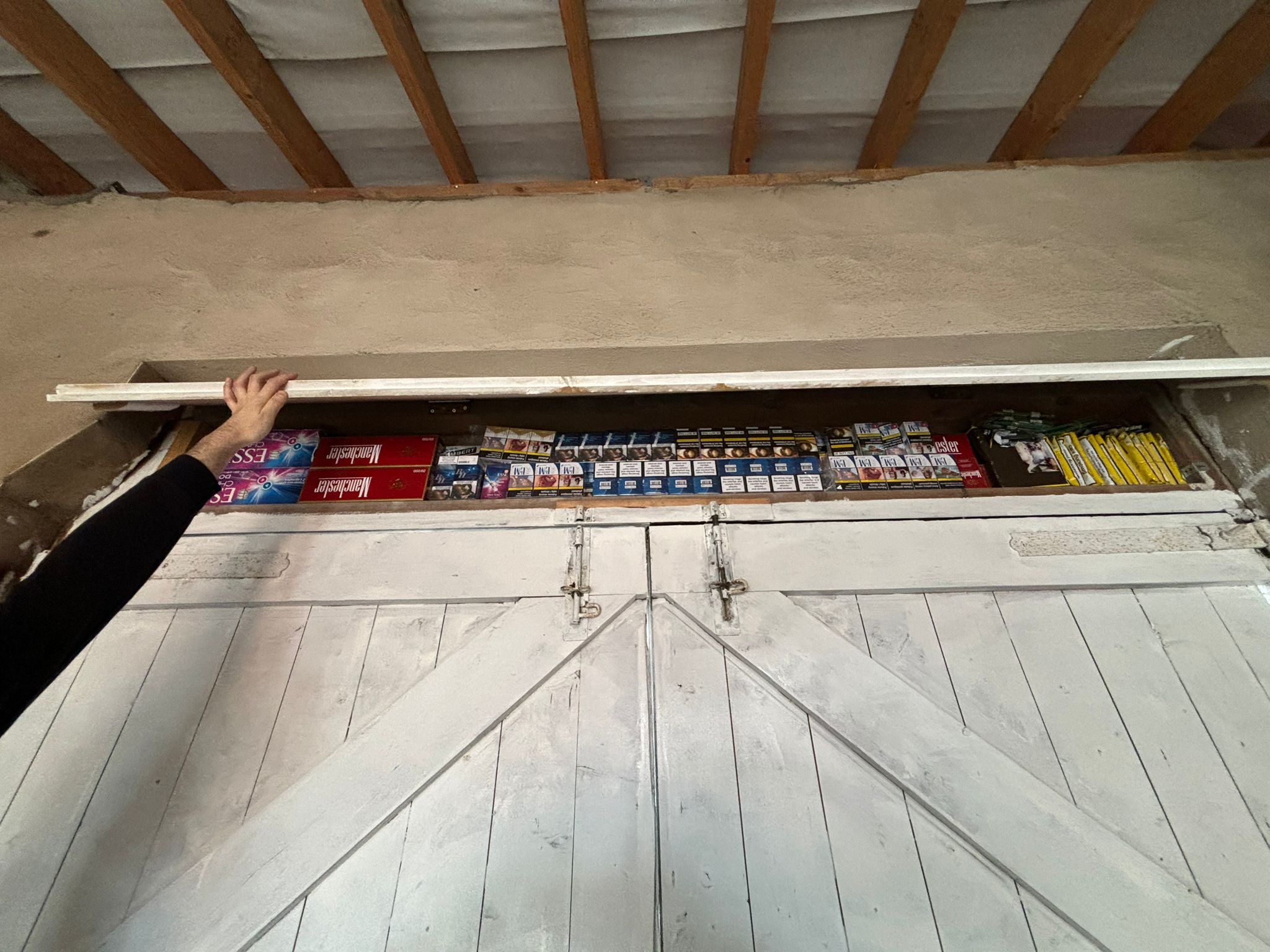 Illegal tobacco products in a cupboard that have been seized