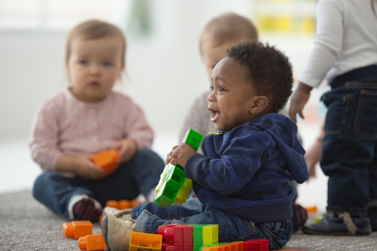 Babies playing with bricks