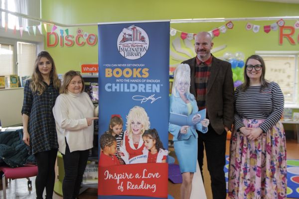 Councillor Mishal Saeed, Councillor Teresa Pepper, Councillor Jim Cammell and Councillor Hannah Robinson-Smith stood with a Dolly Parton pull-up banner