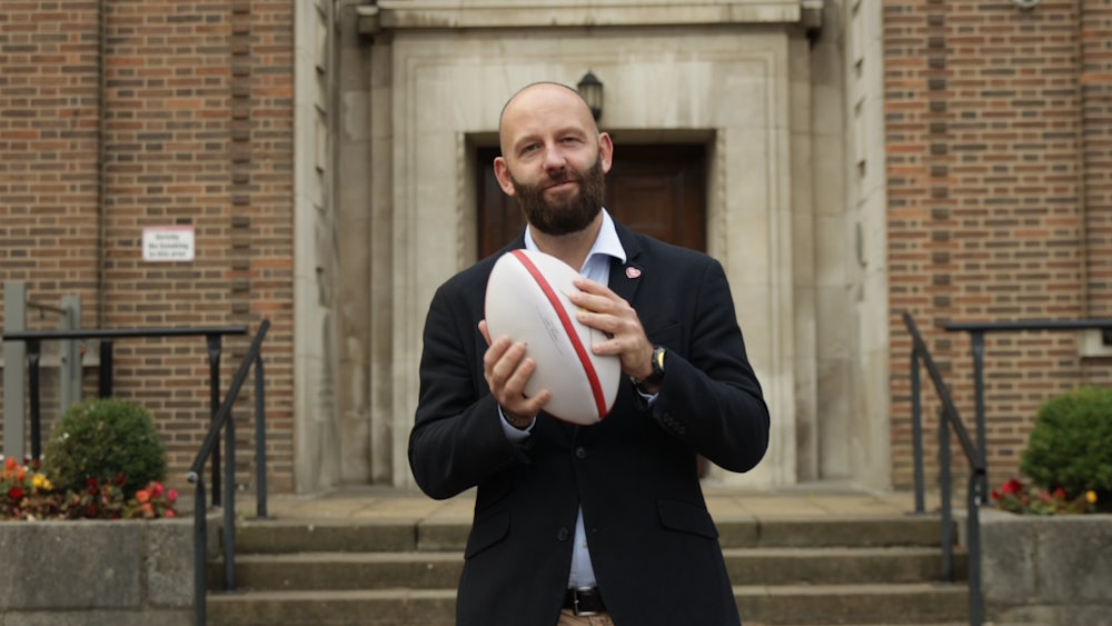Salford City Mayor holding a rugby ball