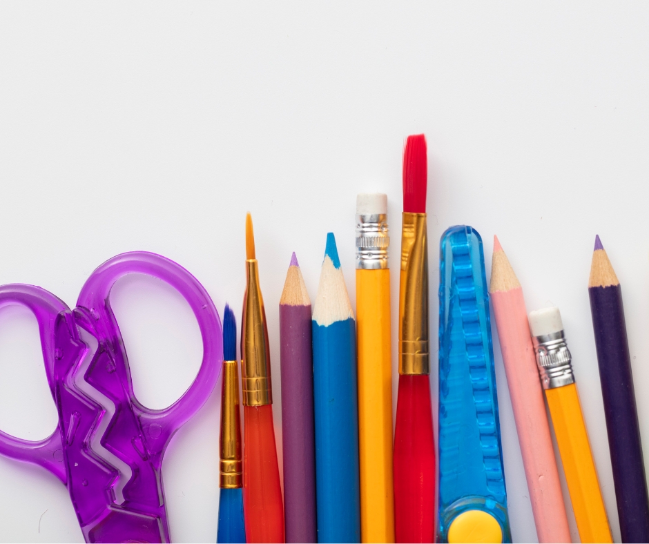 A group of colourful pencils and paint brushes
